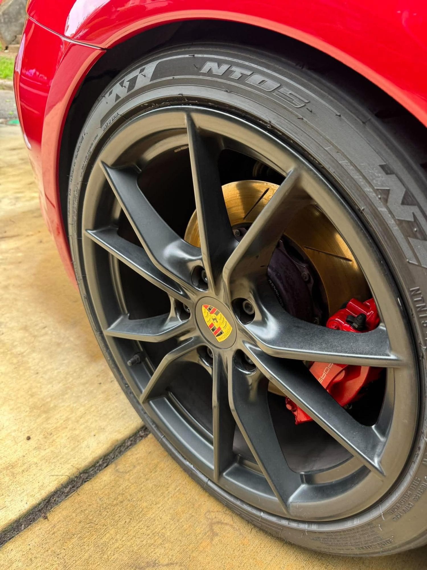 Porsche wheel and tire after cleaning and tire shine
