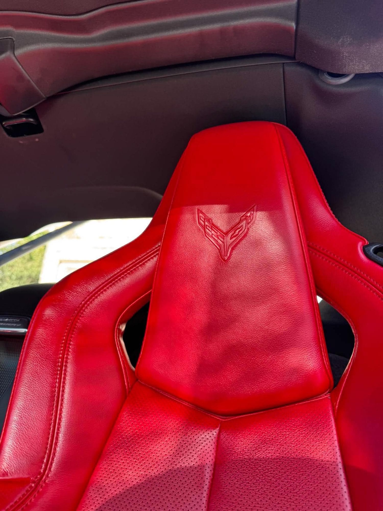 Red Corvette leather seat after cleaning