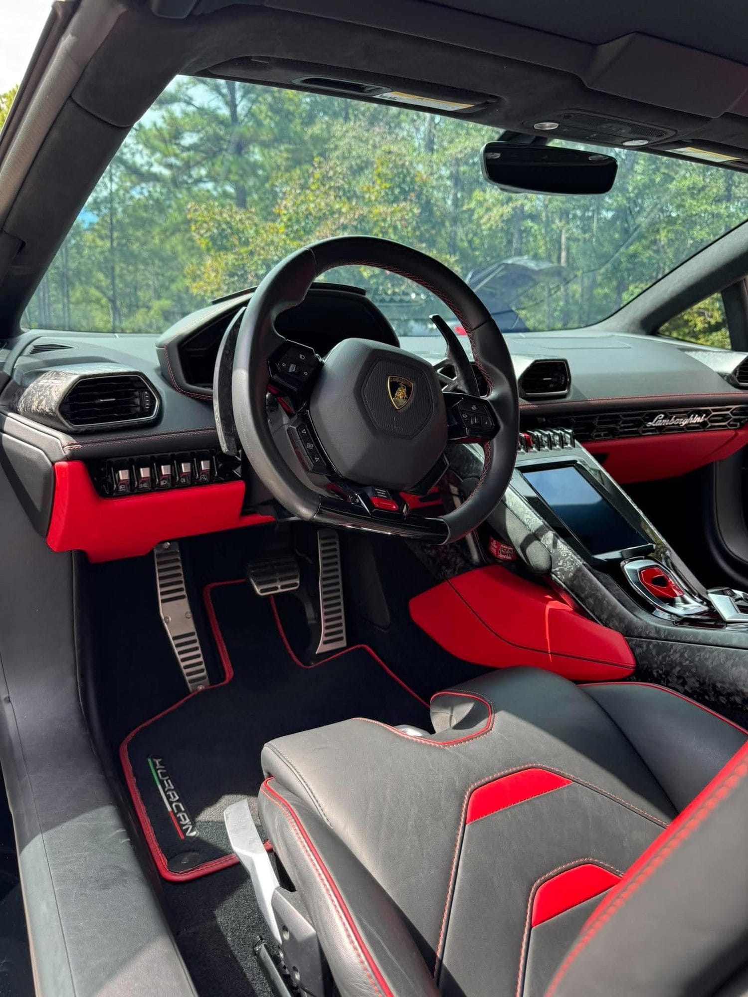 Lamborghini interior with black and red leather after detailing